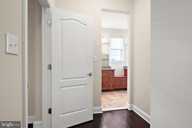 hallway with dark wood-type flooring