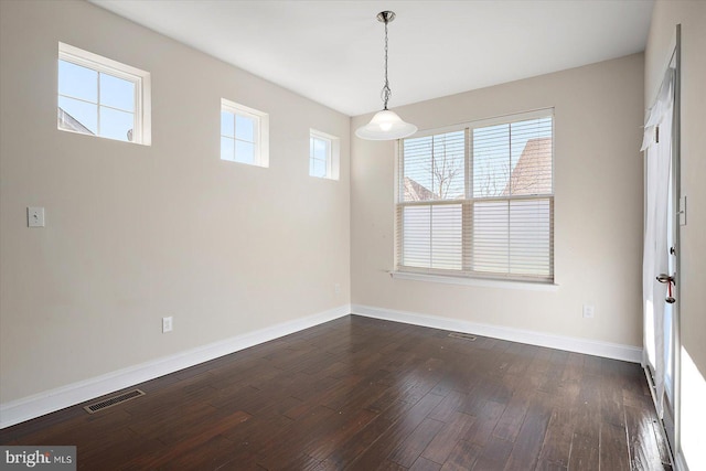 interior space with dark wood-type flooring and a wealth of natural light