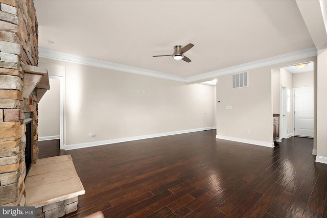 unfurnished living room with ceiling fan, dark hardwood / wood-style flooring, ornamental molding, and a fireplace