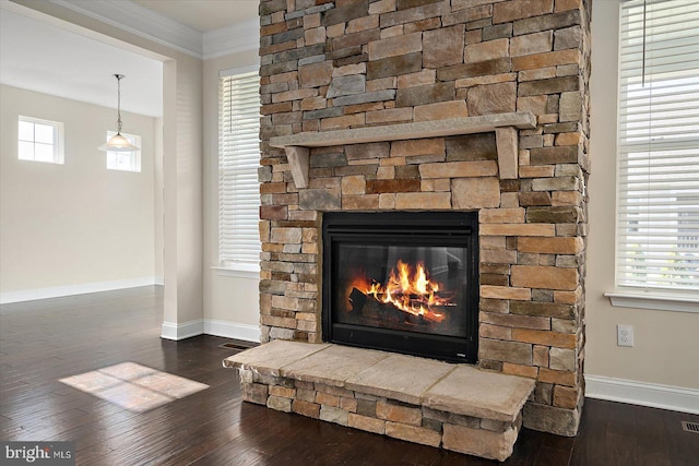 details with hardwood / wood-style flooring, a fireplace, and ornamental molding