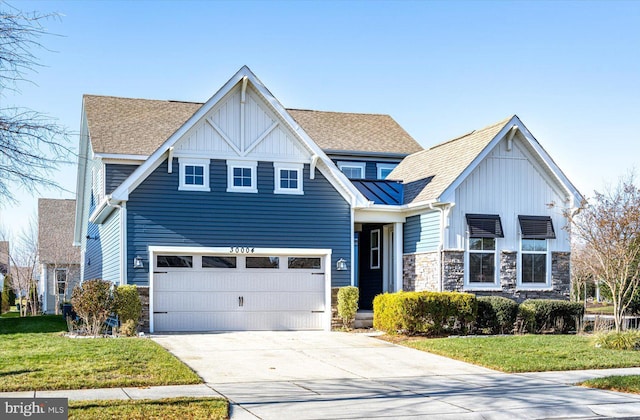 view of front facade with a front lawn and a garage