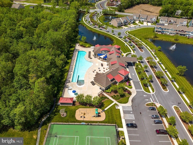 birds eye view of property with a water view