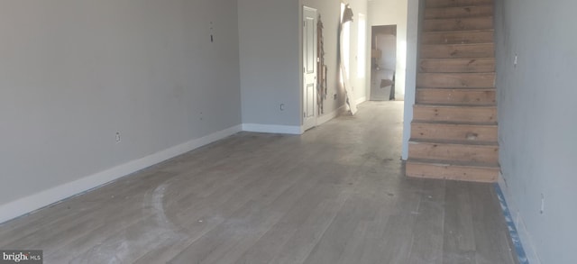 unfurnished room featuring hardwood / wood-style flooring