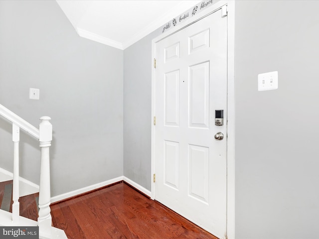 foyer entrance featuring hardwood / wood-style floors and ornamental molding