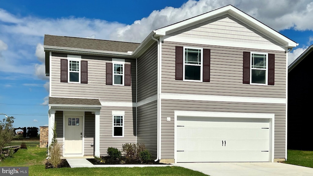 view of front of property featuring a garage