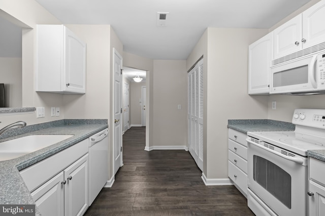 kitchen featuring white cabinetry, sink, dark wood-type flooring, and white appliances