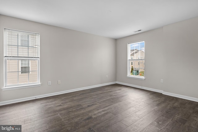 empty room featuring dark hardwood / wood-style floors