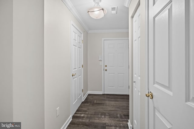 hall featuring dark hardwood / wood-style flooring and crown molding