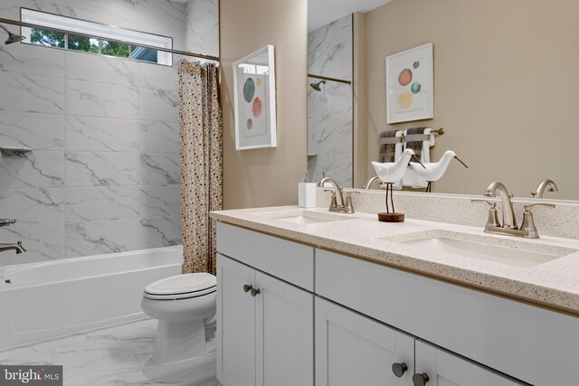 full bathroom featuring shower / tub combo with curtain, vanity, and toilet