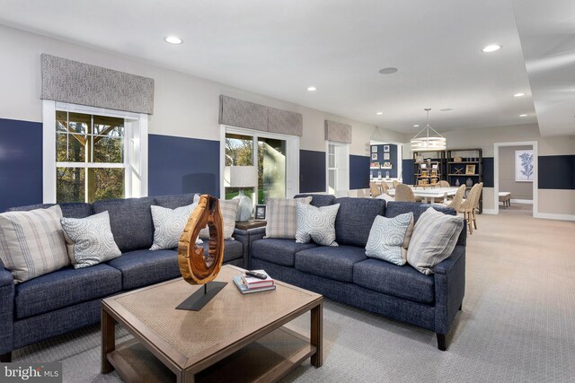 carpeted living room with a wealth of natural light