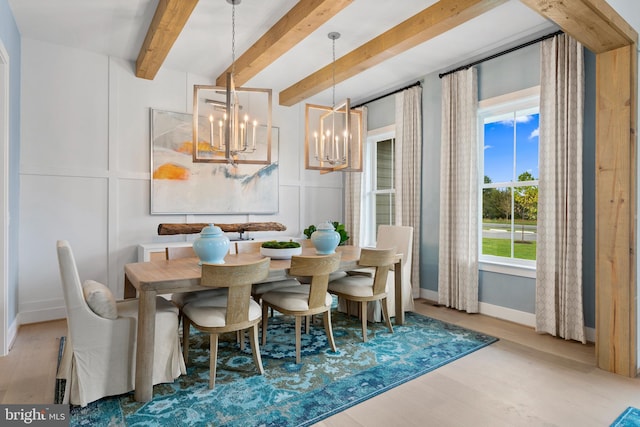 dining space featuring beam ceiling, hardwood / wood-style flooring, and a notable chandelier