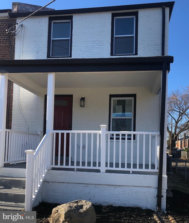 view of property featuring a porch