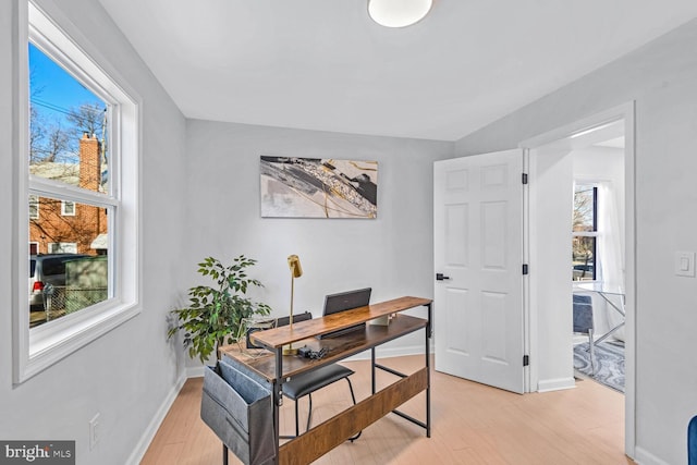 office area with light hardwood / wood-style floors