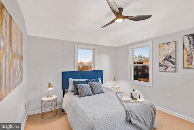 bedroom with wood-type flooring and ceiling fan