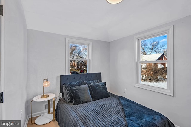 bedroom with multiple windows