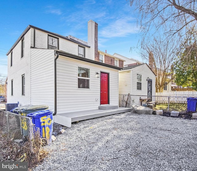 back of house with cooling unit