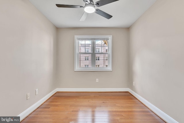 empty room featuring ceiling fan and light hardwood / wood-style flooring