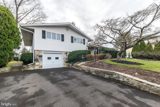 view of side of home featuring a garage