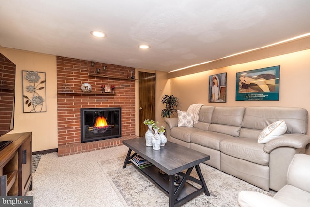 living room featuring light colored carpet and a brick fireplace