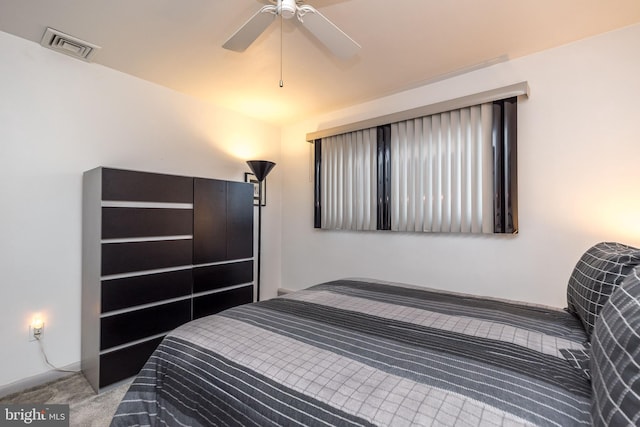 bedroom with light carpet and ceiling fan