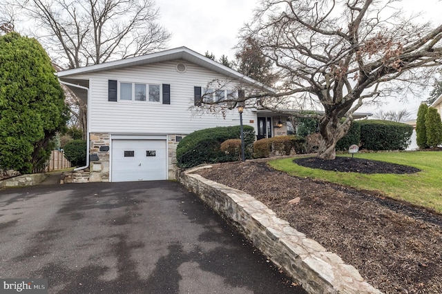 split level home featuring a garage