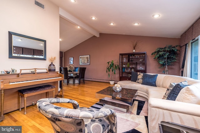 living room with baseboard heating, vaulted ceiling with beams, and light wood-type flooring