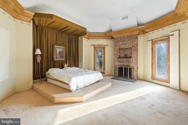 carpeted bedroom featuring vaulted ceiling and a brick fireplace