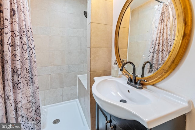 bathroom featuring vanity and a shower with shower curtain