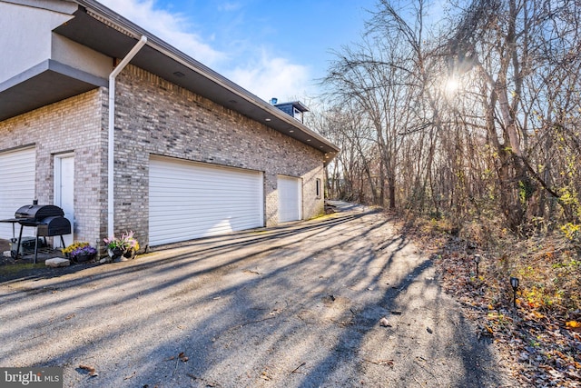 view of side of property featuring a garage