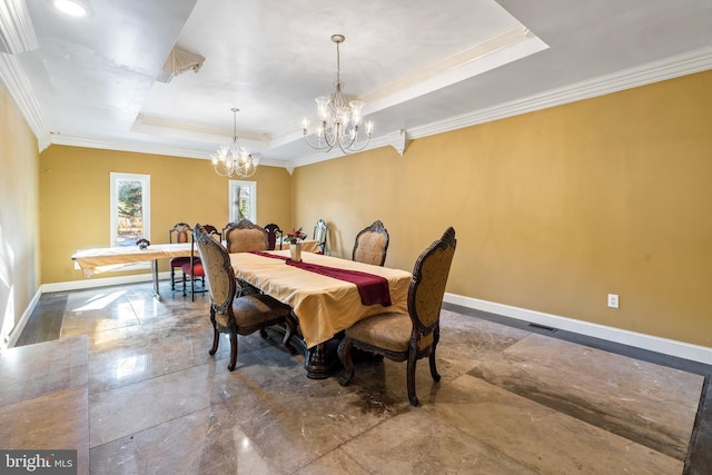 dining room featuring a tray ceiling, an inviting chandelier, and crown molding