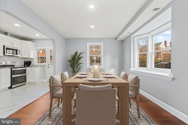 dining room with light hardwood / wood-style flooring