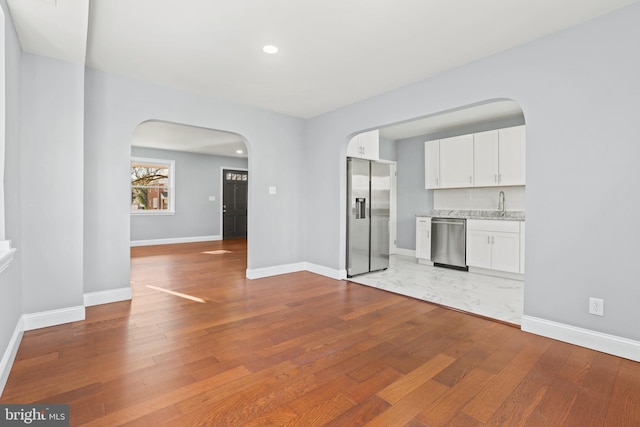 interior space featuring light hardwood / wood-style floors and sink