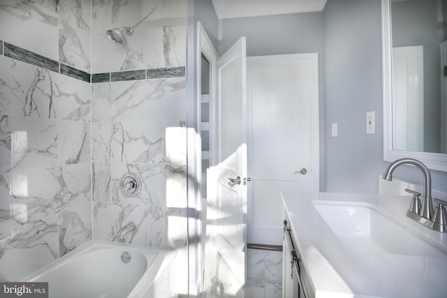 bathroom featuring vanity and tiled shower / bath combo