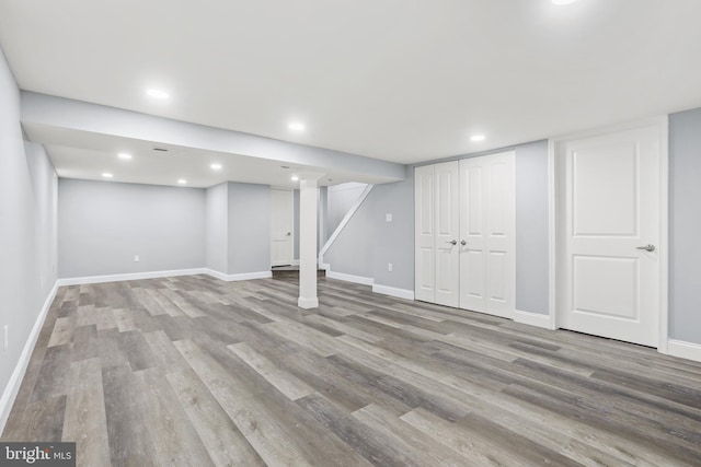 basement featuring light hardwood / wood-style flooring