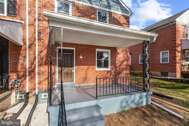 doorway to property with covered porch