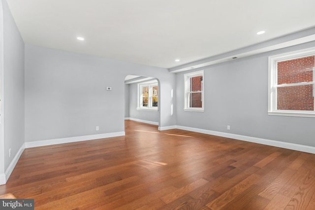 empty room with hardwood / wood-style floors