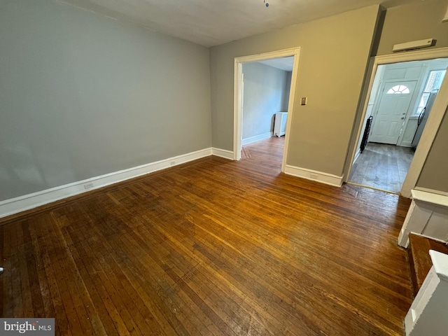 unfurnished room featuring dark hardwood / wood-style floors