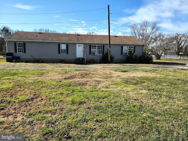 single story home with a front lawn