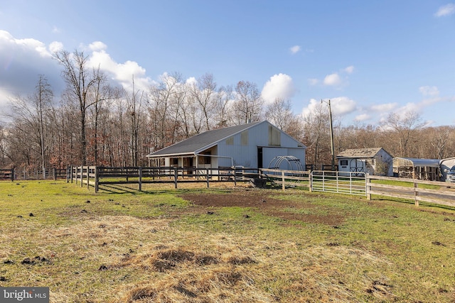 exterior space with a rural view and an outbuilding