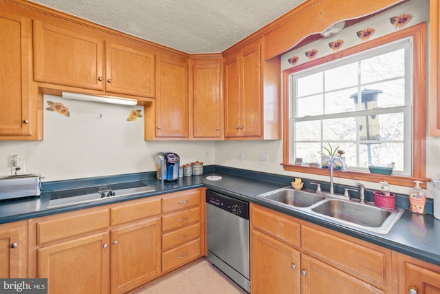 kitchen featuring sink, light tile patterned flooring, stainless steel dishwasher, and a textured ceiling