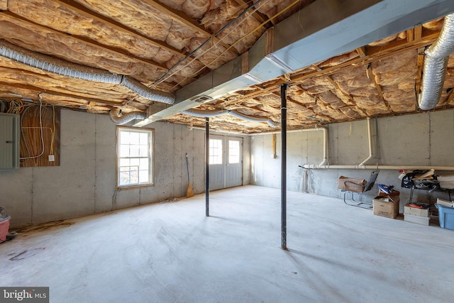 basement featuring electric panel