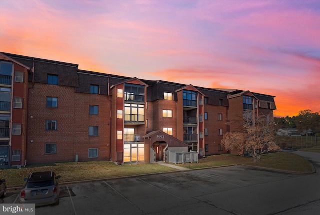 view of outdoor building at dusk