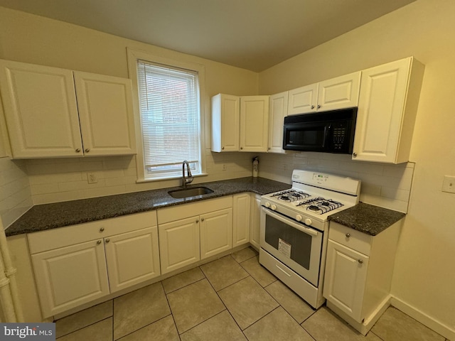 kitchen featuring tasteful backsplash, white range with gas cooktop, sink, white cabinetry, and light tile patterned flooring