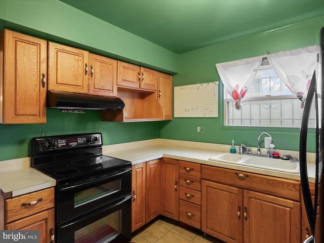 kitchen with black / electric stove, sink, and light tile patterned floors