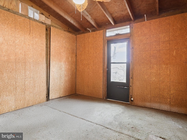 spare room featuring vaulted ceiling