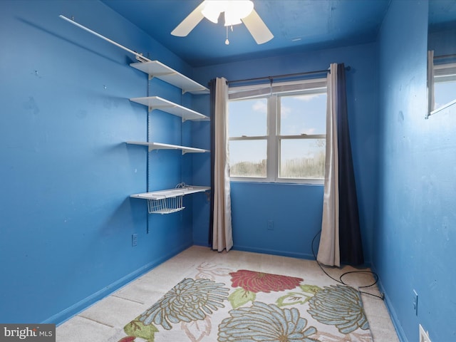 interior space featuring ceiling fan