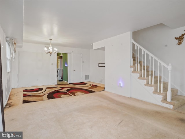 interior space with carpet flooring and a notable chandelier