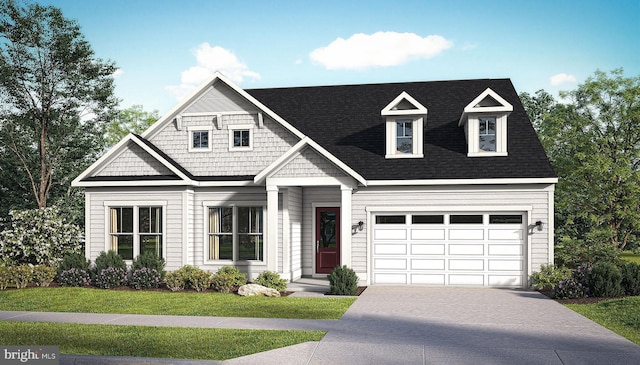 view of front facade with a front yard and a garage