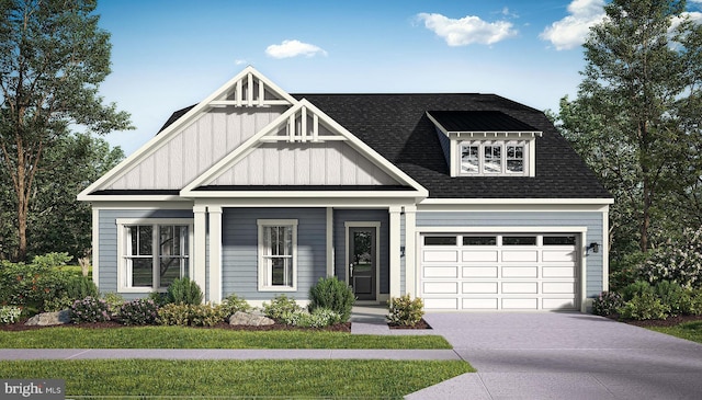 view of front facade with a front yard and a garage