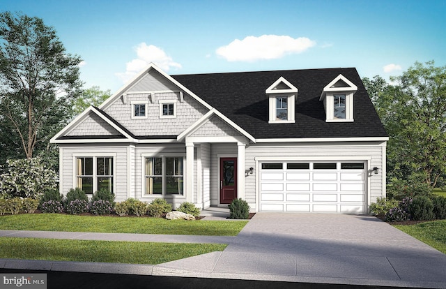 view of front of home featuring a front lawn and a garage